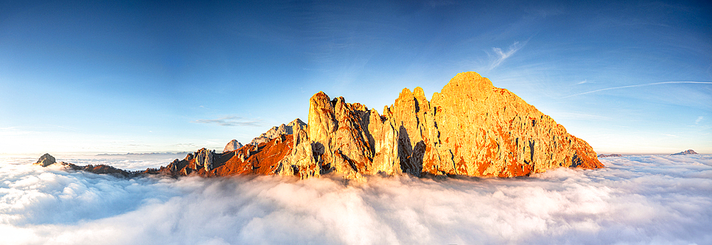 Aerial view of Grignetta (Grigna Meridionale) emerging from autumn fog, Lake Como, Lombardy, Italy