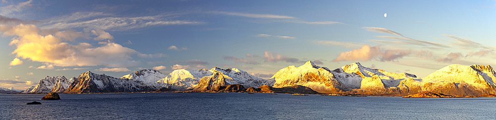 Snowy mountains overlooking the sea, Vestvagoy Island, Lofoten Islands, Norway