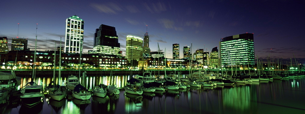 Restaurants and cafes at dusk, waterfront area of Puerto Madero, Buenos Aires, Argentina, South America