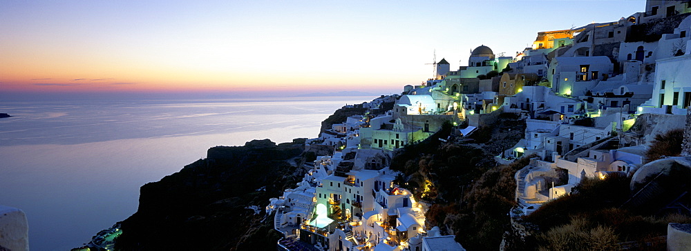 View over the town of Oia at twilight with Aegean Sea in the background, Santorini (Thira), Cyclades Islands, Greek Islands, Greece, Europe