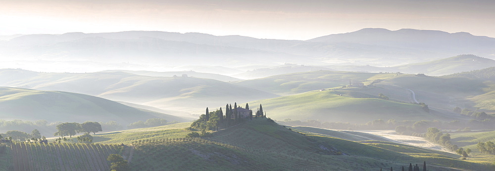 Misty dawn panoramic view towards Belvedere, across Val d'Orcia, UNESCO World Heritage Site, San Quirico d'Orcia, near Pienza, Tuscany, Italy, Europe