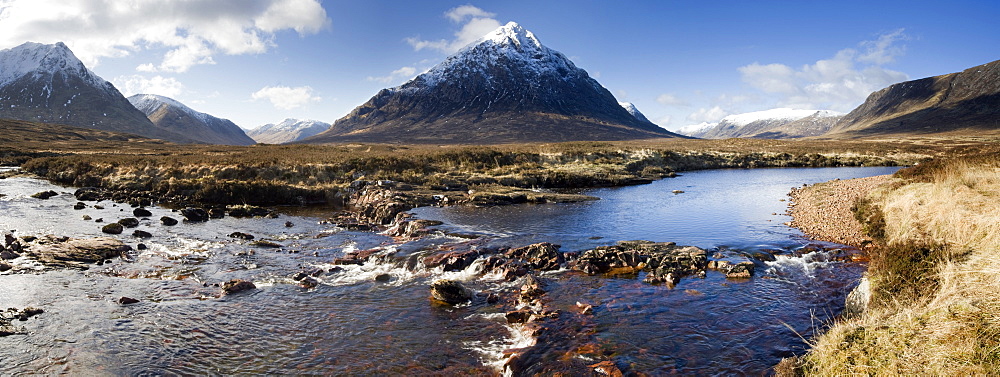 Panoramic view across River Etive towards snow-covered mountains including Buachaille Etive Mor, Rannoch Moor, near Fort William, Highland, Scotland, United Kingdom, Europe