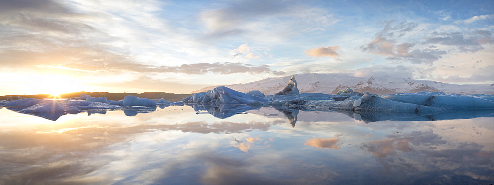 Panoramic view at sunset during winter over Jokulsarlon, a glacial lagoon at the head of the Breidamerkurjokull Glacier on the edge of the Vatnajokull National Park, South Iceland, Iceland, Polar Regions