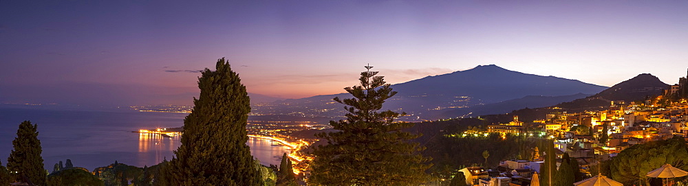 Panoramic view of Mount Etna and Giardini Naxos at dusk from Taormina, Sicily, Italy, Mediterranean, Europe