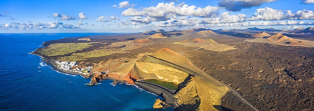 Aerial view of El Golfo village and the volcanic landscape of Timanfaya National Park, Lanzarote, Canary Islands, Spain, Atlantic, Europe