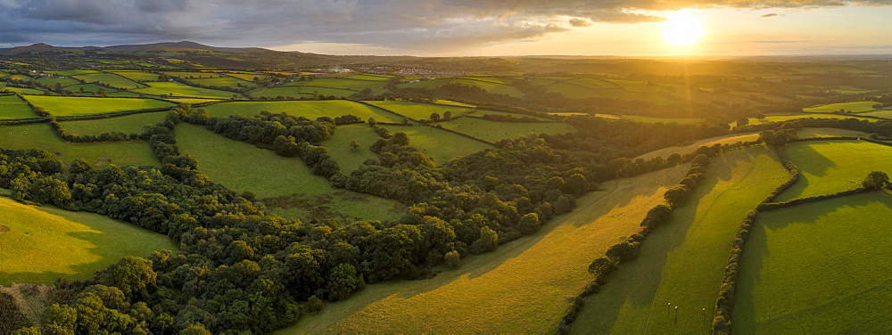 Aerial view by drone of rolling Devon countryside at sunset, Devon, England, United Kingdom, Europe