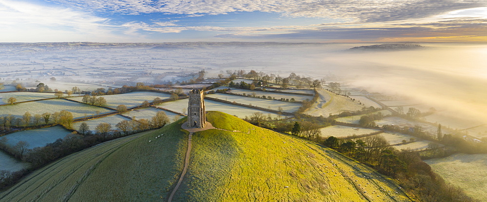 Aerial view by drone of frosty winter morning at Glastonbury Tor, Somerset, England, United Kingdom, Europe