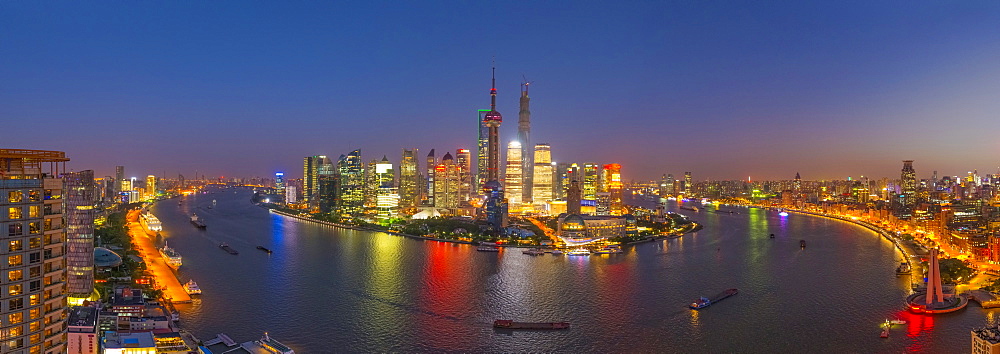 Pudong skyline across Huangpu River, including Oriental Pearl Tower, Shanghai World Financial Center and Shanghai Tower, Shanghai, China, Asia