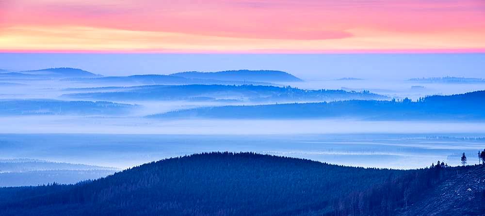 Sunrise on the Brocken, view over hills and forests with valley fog, Harz National Park, Saxony-Anhalt, Germany, Europe