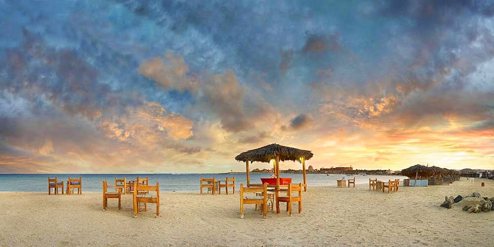 Sandy beach beach with bar at the coral reef Abu-Dabbab at sunset, Hilton Nubian Resort, Al Qusair, Marsa Alam, Egypt, Africa