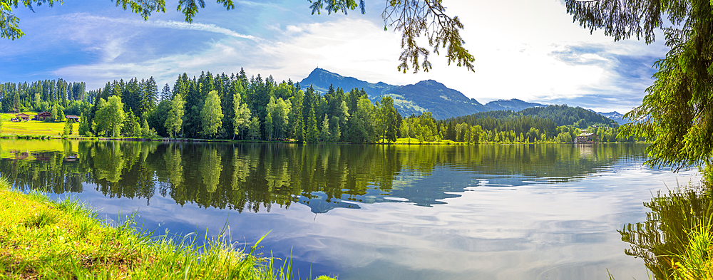 View of reflections in Schwarzsee, Kitzbuhel, Austrian Tyrol, Austria, Europe