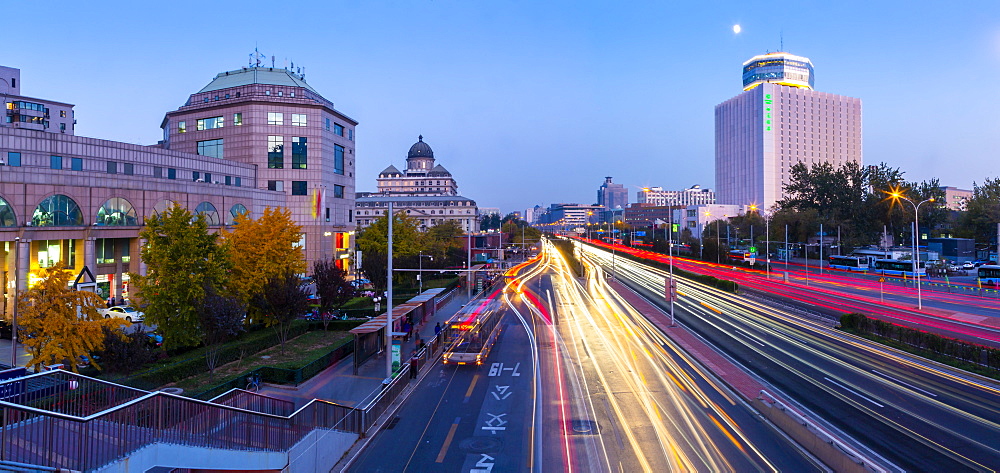 Traffic trail lights on major road near Beijing Zoo at dusk, Beijing, People's Republic of China, Asia