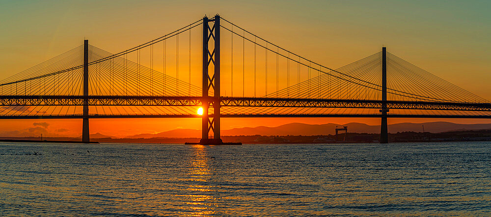 View of the Forth Road Bridge and Queensferry Crossing over the Firth of Forth at sunset, South Queensferry, Edinburgh, Lothian, Scotland, United Kingdom, Europe