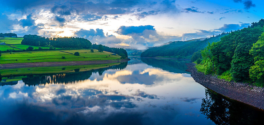 View of dramatic clouds reflecting in Ladybower Reservoir at sunset, Peak District National Park, Derbyshire, England, United Kingdom, Europe