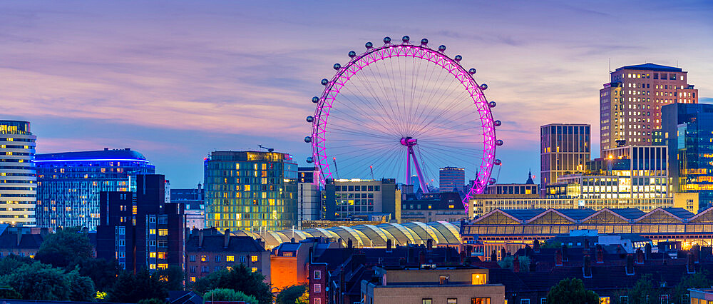 View of the London Eye and rooftop of Waterloo Station at dusk, Waterloo, London, England, United Kingdom, Europe