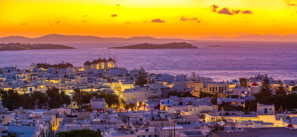 View of windmills and Aegean Sea from elevated position at sunset, Mykonos Town, Mykonos, Cyclades Islands, Greek Islands, Aegean Sea, Greece, Europe