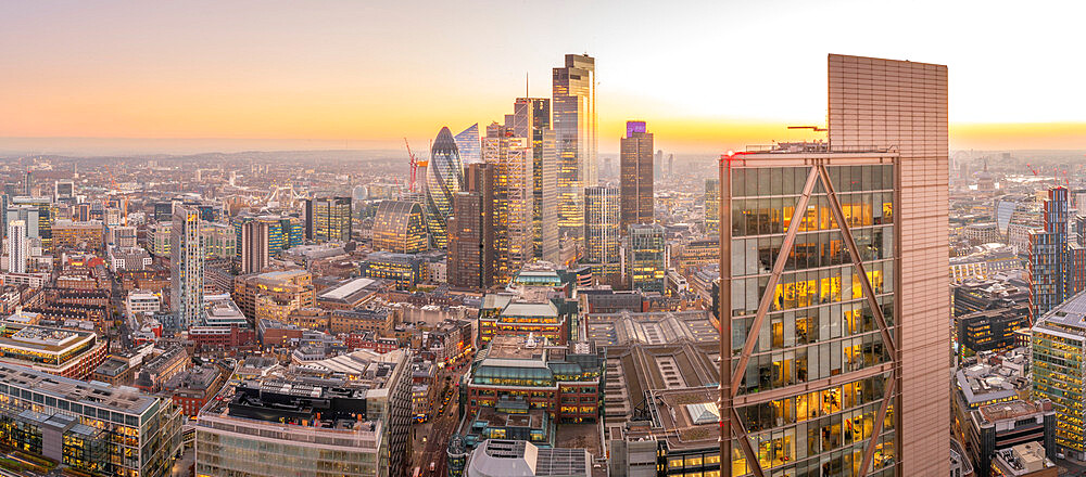 Panoramic view of City of London skyscrapers and Tower Bridge at dusk from the Principal Tower, London, England, United Kingdom, Europe