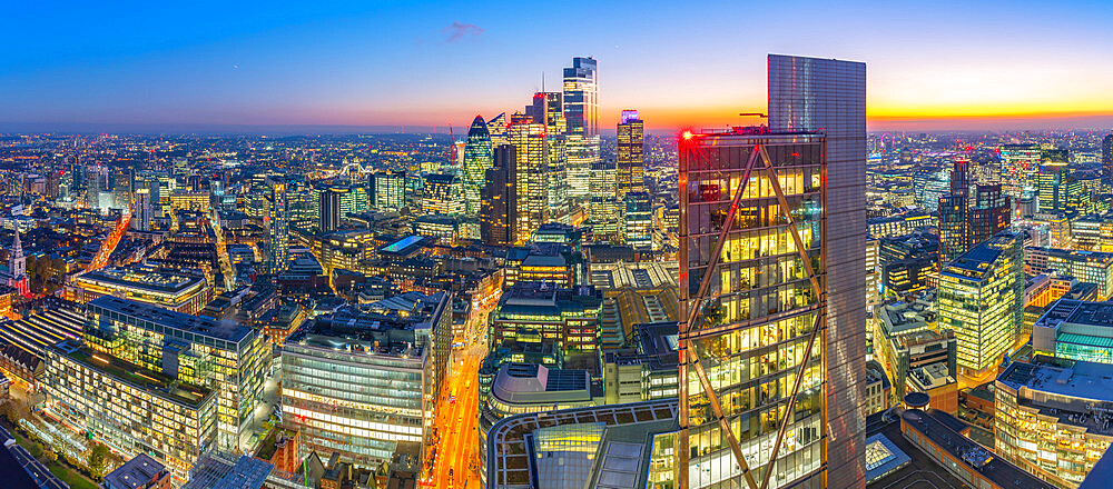 Panoramic view of City of London skyscrapers and Tower Bridge at dusk from the Principal Tower, London, England, United Kingdom, Europe