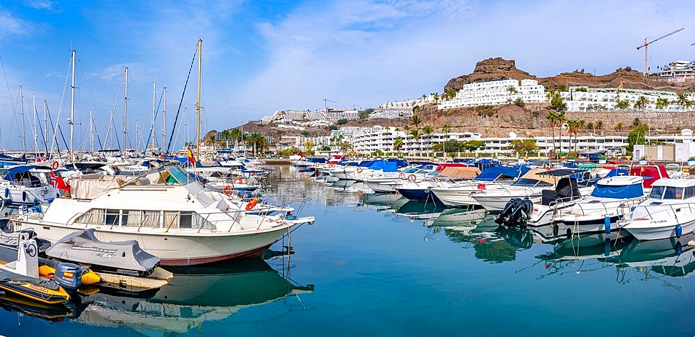 View of harbour, boats and town, Playa de Puerto Rico, Gran Canaria, Canary Islands, Spain, Atlantic, Europe