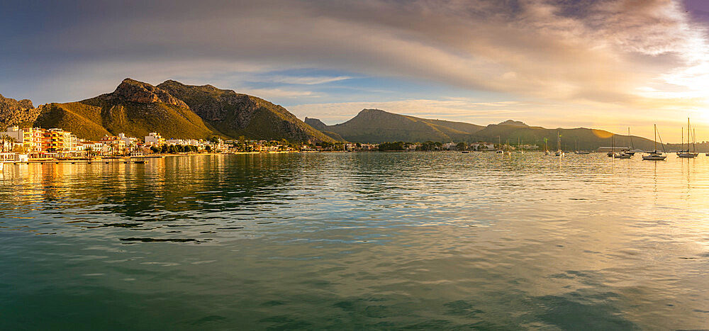 View of sunrise reflecting on hotels and bars in Port de Pollenca, Port de Pollenca, Majorca, Balearic Islands, Spain, Mediterranean, Europe