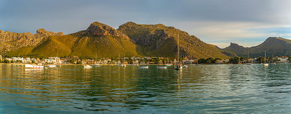 View of sunrise reflecting on hotels and bars in Port de Pollenca, Port de Pollenca, Majorca, Balearic Islands, Spain, Mediterranean, Mediterranean, Europe