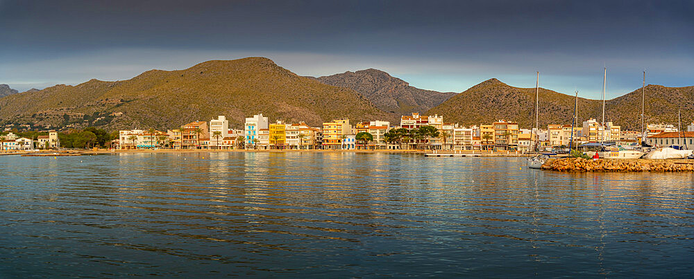 View of sunrise reflecting on hotels and bars in Port de Pollenca, Port de Pollenca, Majorca, Balearic Islands, Spain, Mediterranean, Europe