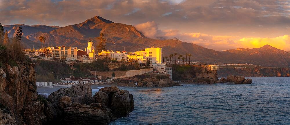 View of Parroquia El Salvador and coastline at sunset in Nerja, Nerja, Malaga Province, Andalucia, Spain, Europe