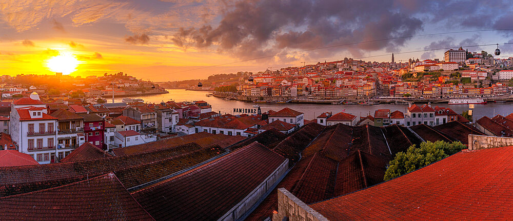 View of sunset over terracota rooftops and Douro River in the old town of Porto, Porto, Norte, Portugal, Europe