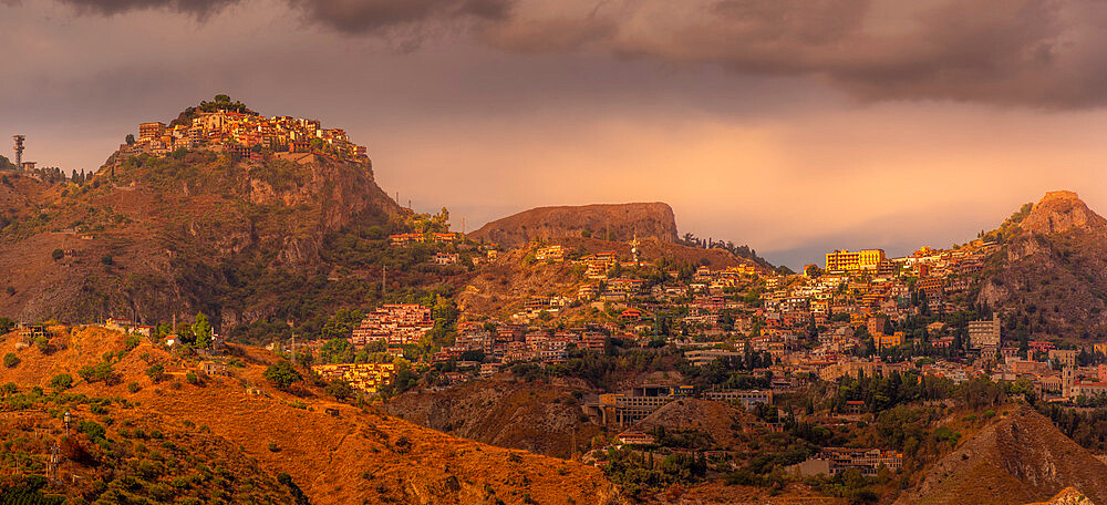 View of hilltop towns of Castelmola and Taormina at sunset, Province of Messina, Sicily, Italy, Mediterranean, Europe