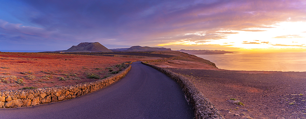 View of road and volcanic coastline from Mirador del Rio at sunset, Lanzarote, Las Palmas, Canary Islands, Spain, Atlantic, Europe