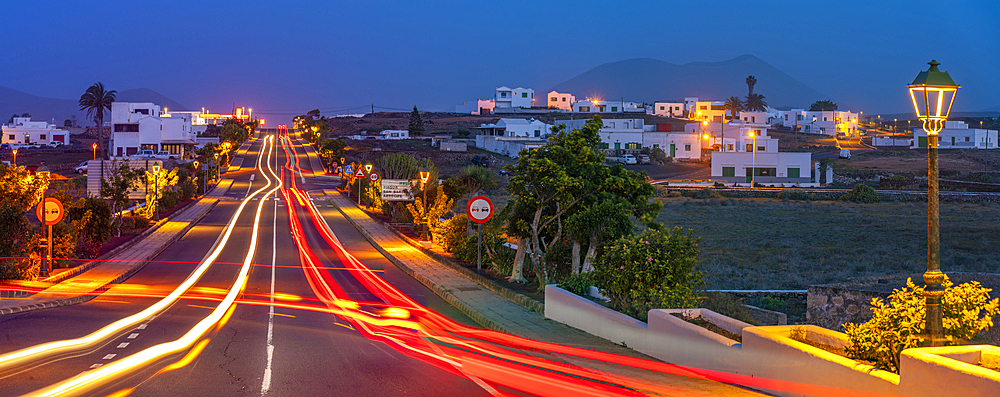 View of trail lights through the town of Tinajo at dusk, Tinajo, Lanzarote, Las Palmas, Canary Islands, Spain, Atlantic, Europe