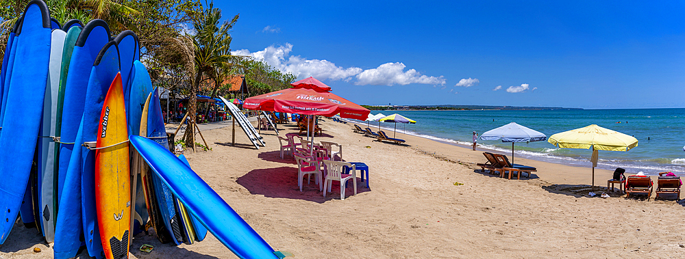 View of colourful sunshades and surf boards on sunny morning on Kuta Beach, Kuta, Bali, Indonesia, South East Asia, Asia