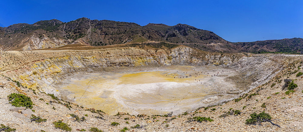 View of visitors exploring the Stefanoskrater Crater, Nisyros, Dodecanese, Greek Islands, Greece, Europe