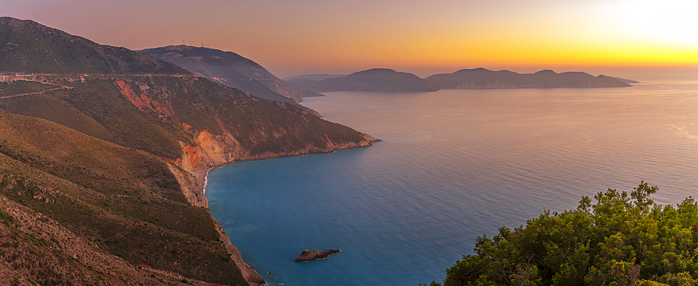 View of coastline, sea and hills near Assos at sunset, Kefalonia, Ionian Islands, Greek Islands, Greece, Europe