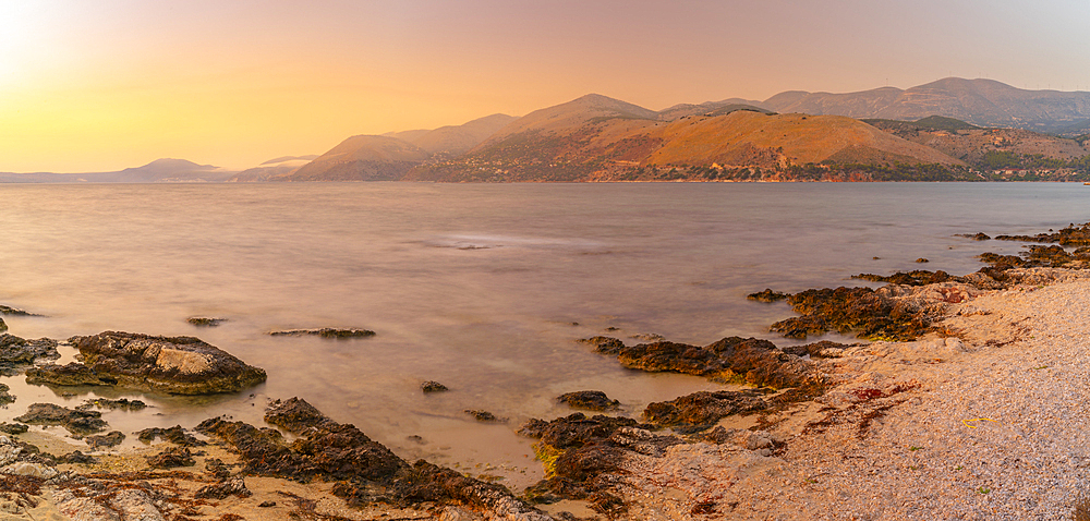 View of coastline near Saint Theodore Lighthouse at sunset, Argostolion, Kefalonia, Ionian Islands, Greek Islands, Greece, Europe