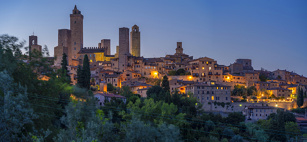 View of San Gimignano skyline at dusk, San Gimignano, UNESCO World Heritage Site, Province of Siena, Tuscany, Italy, Europe