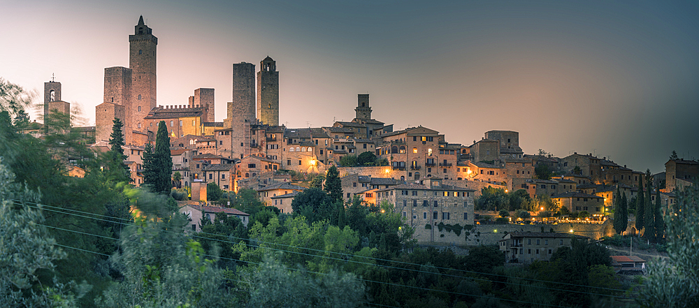 View of San Gimignano skyline at dusk, San Gimignano, UNESCO World Heritage Site, Province of Siena, Tuscany, Italy, Europe