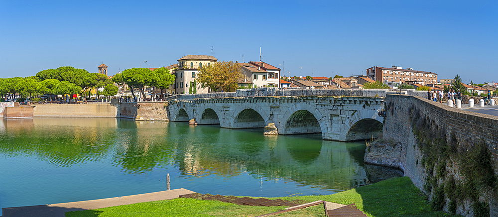 View of Ponte di Tiberio reflecting in Rimini Canal in Borgo San Giuliano district in Rimini, Rimini, Emilia-Romagna, Italy, Europe