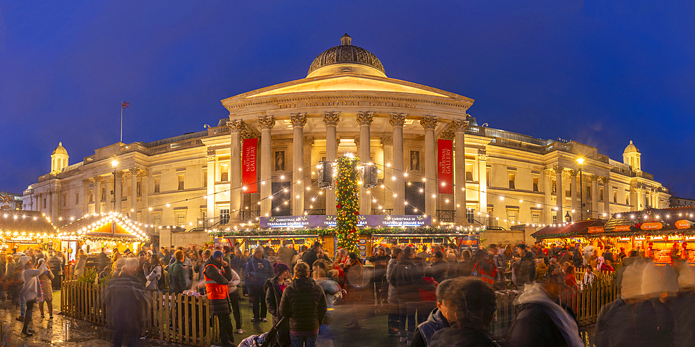 View of Christmas market and The National Gallery in Trafalgar Square at dusk, Westminster, London, England, United Kingdom, Europe