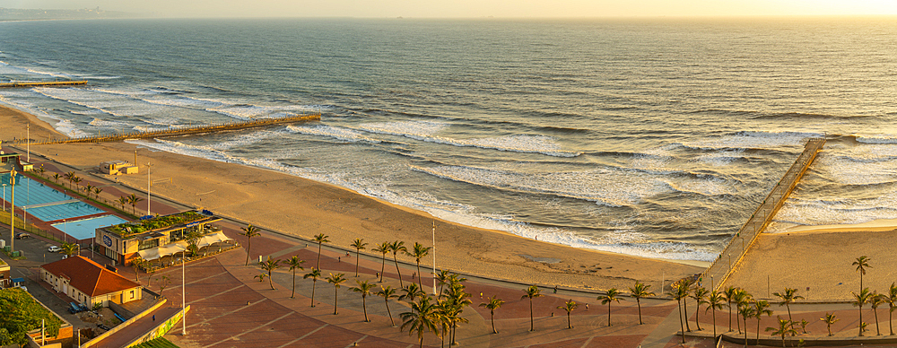 Elevated view of beaches, promenade and Indian Ocean at sunrise, Durban, KwaZulu-Natal Province, South Africa, Africa