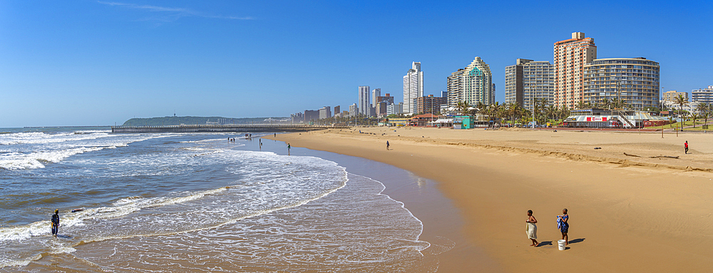 View of local people on beach, promenade and hotels, Durban, KwaZulu-Natal Province, South Africa, Africa