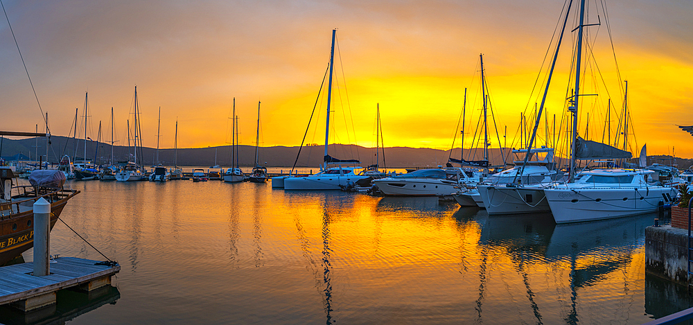 View of golden sunset and boats at Knysna Waterfront, Knysna, Western Cape Province, South Africa, Africa