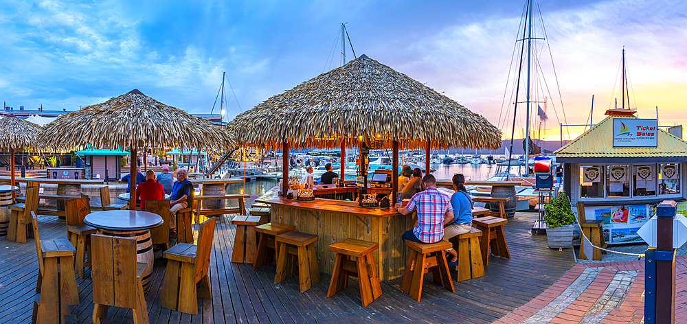 View of golden sunset, boats and restaurants at Knysna Waterfront, Knysna, Western Cape Province, South Africa, Africa