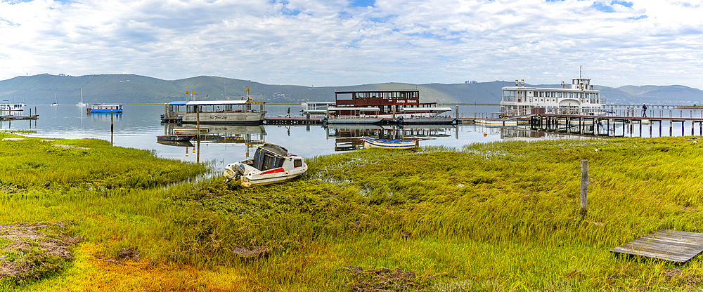 View of boats on Knysna River with Featherbed Nature Reserve in background, Knysna, Garden Route, Western Cape, South Africa, Africa