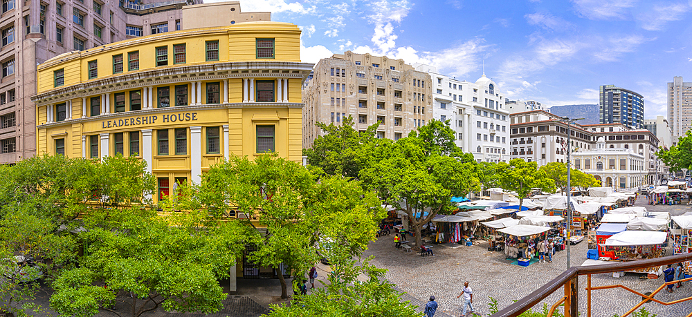 Elevated view of trees, buildings and souvenir stalls on Greenmarket Square, Cape Town, Western Cape, South Africa, Africa