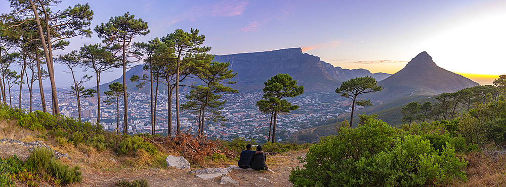 View of couple and Table Mountain from Signal Hill at sunset, Cape Town, Western Cape, South Africa, Africa