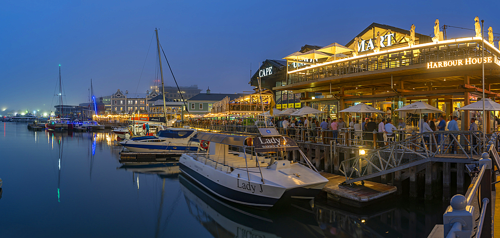 View of boats and restaurants in the Waterfront at dusk, Cape Town, Western Cape, South Africa, Africa