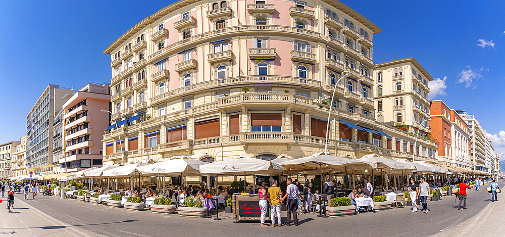 View of pastel coloured architecture, restaurants and cafes on seafront of Via Partenope, Naples, Campania, Italy, Europe