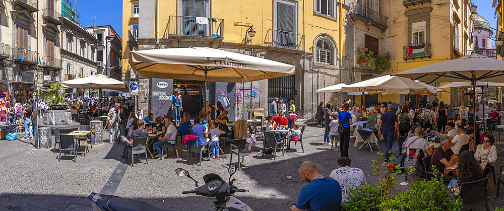 View of bars and architecture in bustling Piazzetta Nilo, Naples, Campania, Italy, Europe