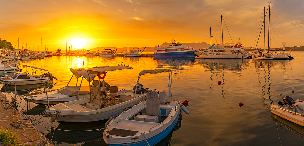 View of boats in Old Port Marina at sunset, Corfu, Ionian Sea, Greek Islands, Greece, Europe